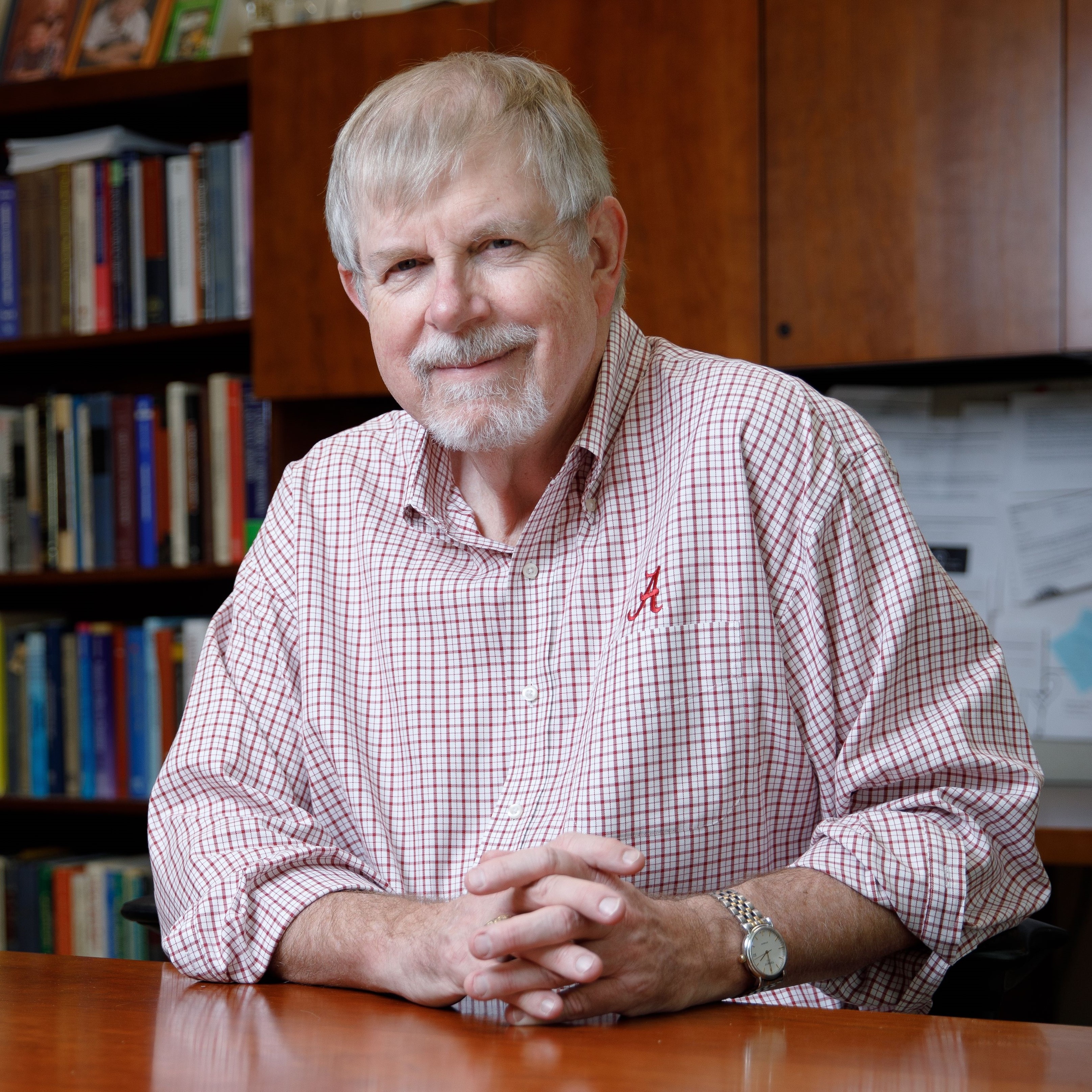 Dr. David Dixon Dr. David Dixon sitting at his desk at University of Alabama